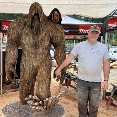 Bob with a sasquatch carving